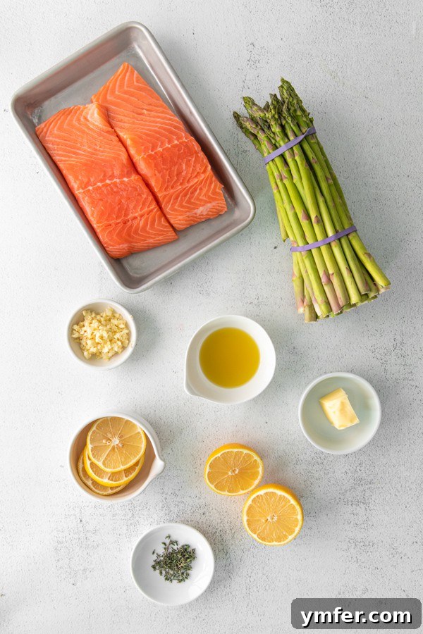 Zesty Lemon Salmon Sheet Pan Dinner 3 Ingredients for Sheet Pan Lemon Salmon laid out