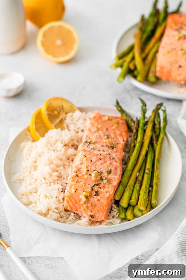 Zesty Lemon Salmon Sheet Pan Dinner 4 Sheet Pan Lemon Salmon served with white rice.