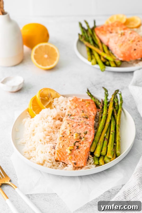Zesty Lemon Salmon Sheet Pan Dinner 6 Sheet Pan Lemon Salmon on a plate.