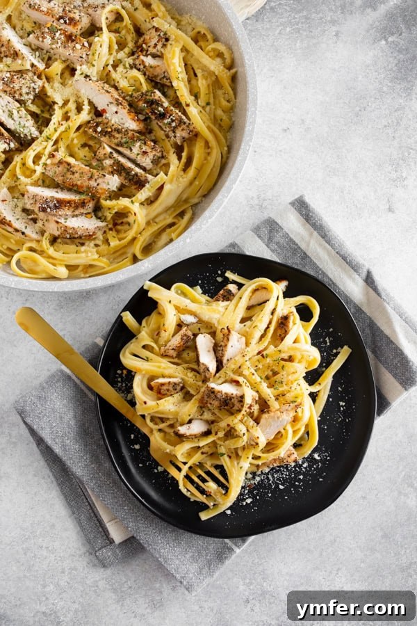 Ultimate Chicken Fettuccine Alfredo 4 Chicken Fettuccine Alfredo served on a plate.