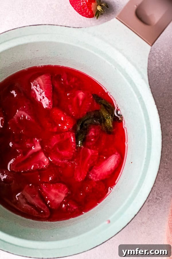 Fresh Strawberry Basil Elixir 4 Ingredients for homemade strawberry basil simple syrup: a bowl of sliced fresh strawberries, a bunch of basil, a bowl of sugar, and a glass of water.