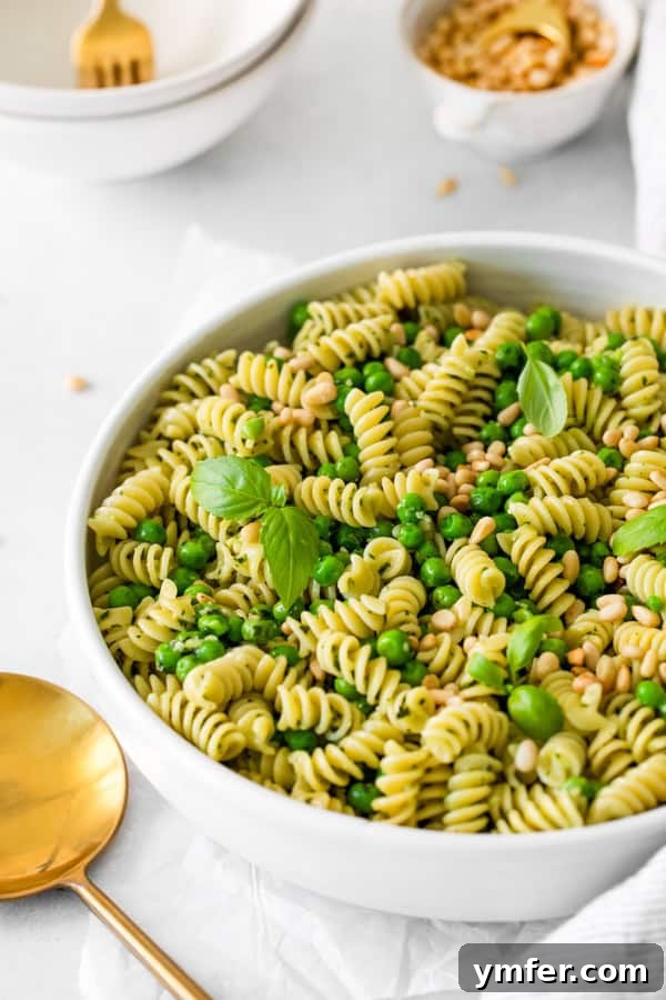 Vibrant Pesto Pasta Salad 4 Close-up view of Pesto Pasta Salad in a serving bowl, highlighting the fresh ingredients.