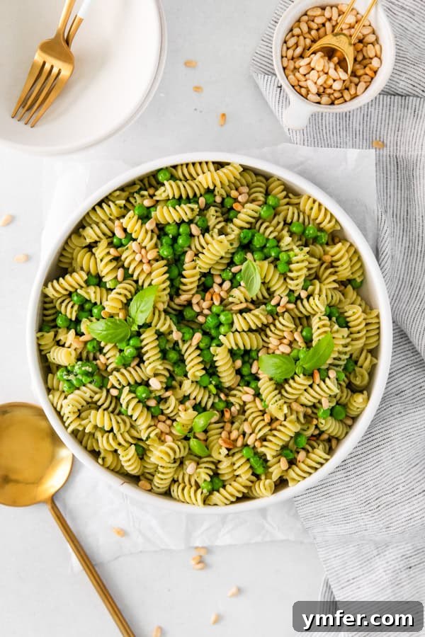 Vibrant Pesto Pasta Salad 5 Pesto Pasta Salad elegantly presented in a large white serving bowl, ideal for entertaining.