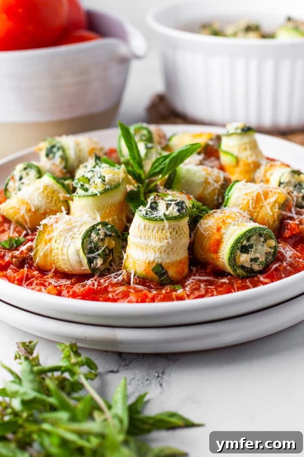 Zucchini Lasagna Rolls sprinkled with cheese. 