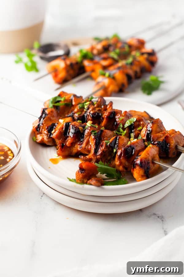Sweet Heat Chicken Kebabs 4 Hot Honey Chicken Skewers on a plate.