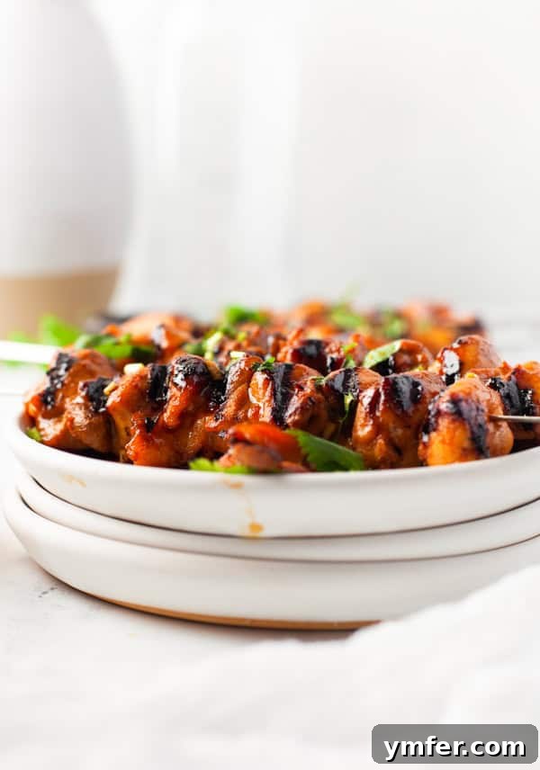 Sweet Heat Chicken Kebabs 6 Hot Honey Chicken Skewers served on a plate.