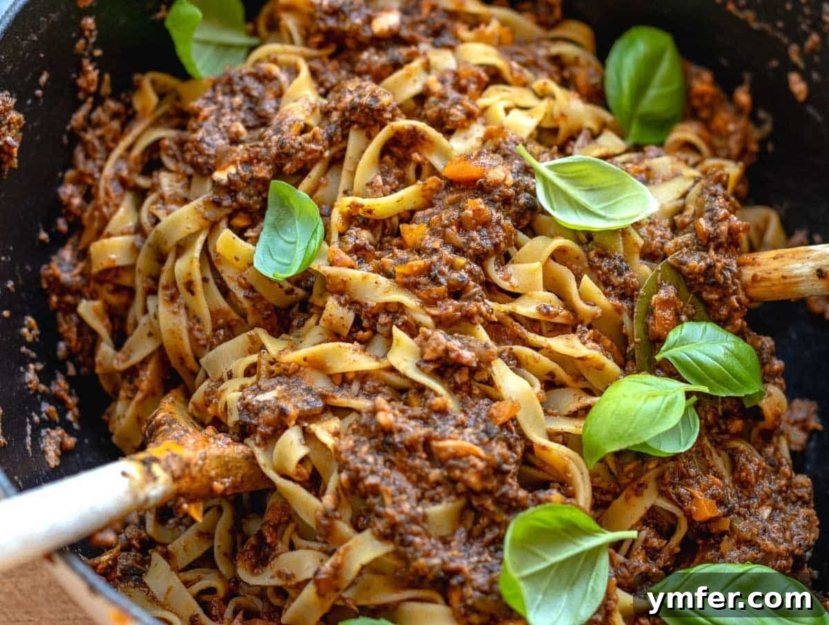 Rich Fungi Ragout 6 fettuccine with vegan bolognese in a large pot