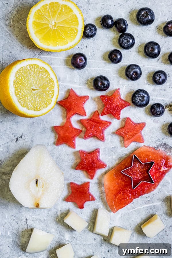 Nation's Nectar 3 Fresh fruit, including watermelon and blueberries, ready for preparation on a cutting board.