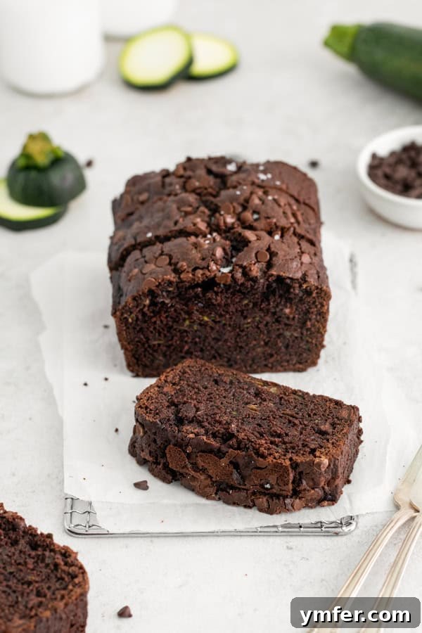 Decadent Chocolate Zucchini Bread 6 A slice of Chocolate Zucchini Bread on a table.