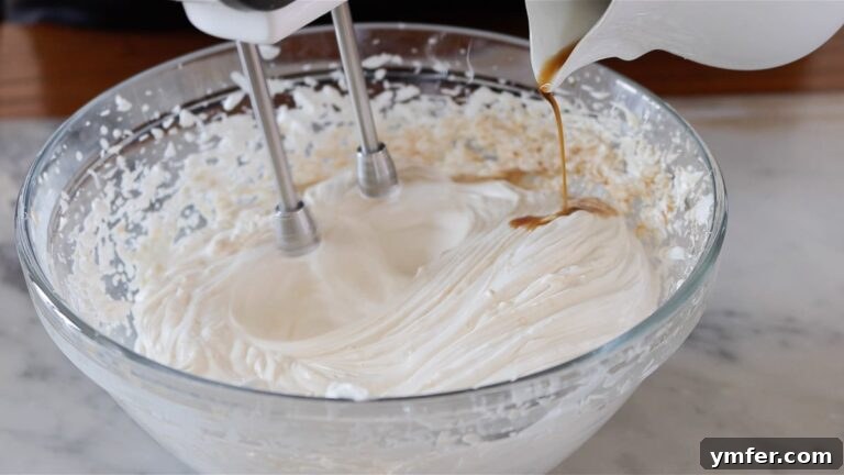adding the coffee to the whipped cream