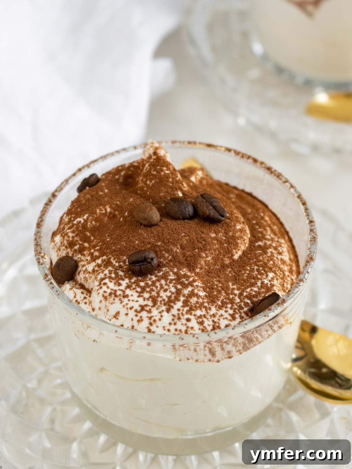 Espresso Cloud 8 coffee mousse in a glass with cacao powder on top
