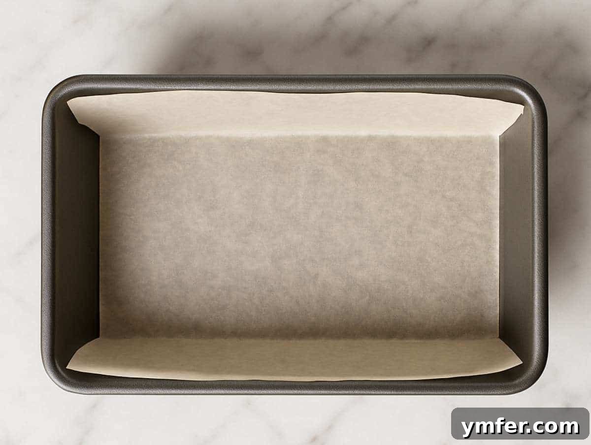 Lush Blueberry Pound Cake 4 Step 1: Loaf pan meticulously lined with parchment paper, ready for the blueberry pound cake batter.