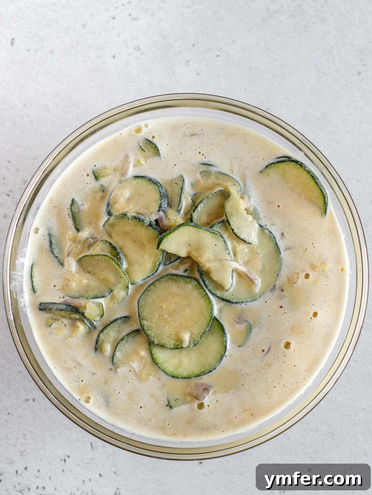 Wholesome Vegan Zucchini Pie 12 Mixing cooked zucchini into the chickpea batter