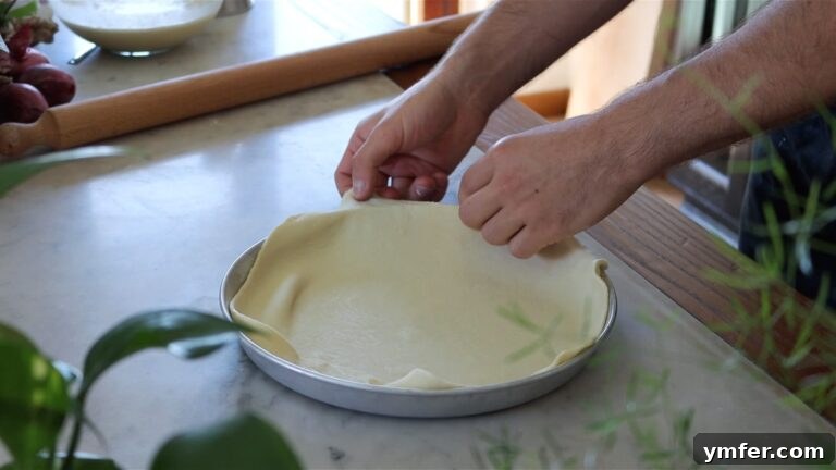 Wholesome Vegan Zucchini Pie 22 Fitting the dough into the pie dish