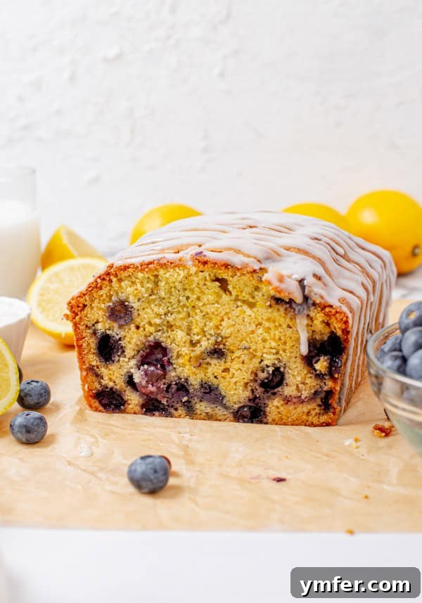 Bursting Blueberry Lemon Loaf 4 Blueberry Lemon Pound Cake sliced to show the center of the bread.