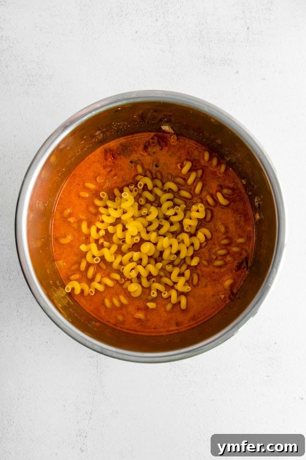 Hearty Instant Pot Chili Mac 4 Instant Pot inner pot filled with the delicious chili mac mixture before sealing.