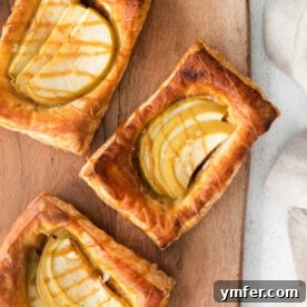 A beautifully baked caramel apple danish, glistening with caramel, ready to be served.
