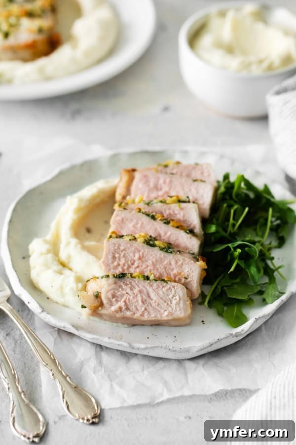 Perfect Air Fryer Pork Chops 6 Air Fryer Pork Chops on a white plate.