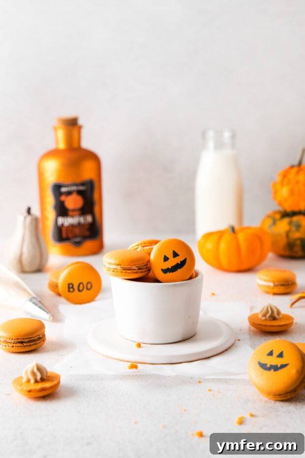 Seasonal Pumpkin Spice Macarons 6 Beautifully decorated Pumpkin Spice Macarons featuring intricate Halloween-themed designs, perfect for a spooky treat.