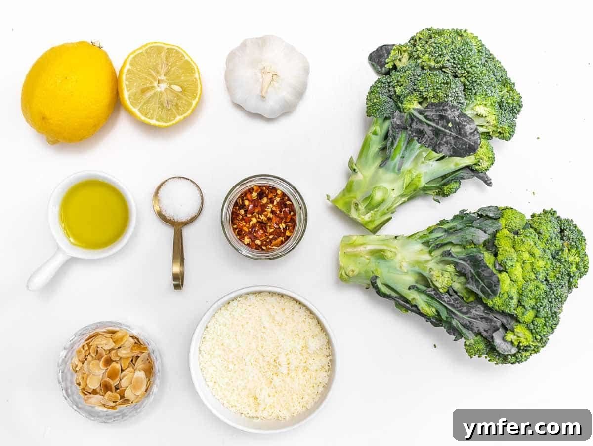 Fresh broccoli head and ingredients for lemon-garlic dressing