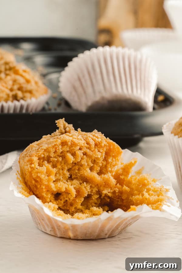 Spiced Sweet Potato Muffins 5 A sweet potato muffin cut in half, revealing its moist, tender interior.