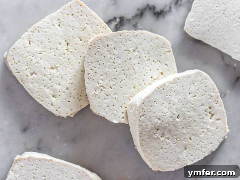 The Vegan Catch 16 tofu slices on a cooking top