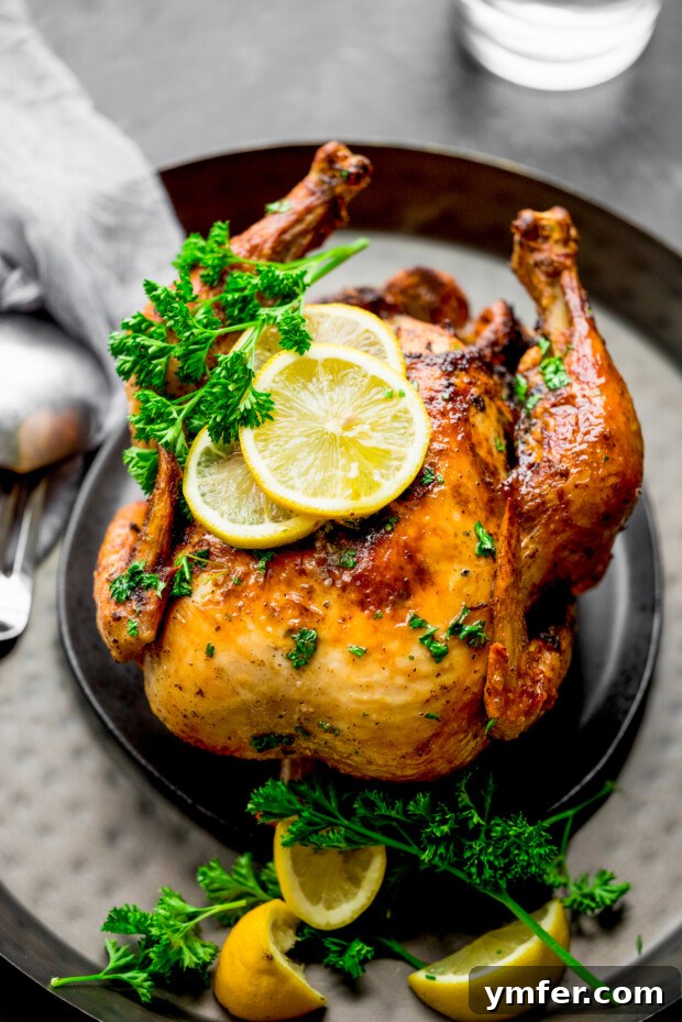 Crispy Air Fryer Whole Chicken 6 Air Fryer Whole Chicken sitting on a serving platter.