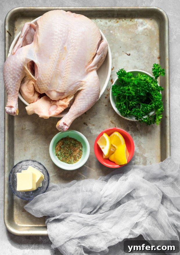 Crispy Air Fryer Whole Chicken 3 Ingredients to make Air Fryer Whole Chicken sitting on a sheet pan.