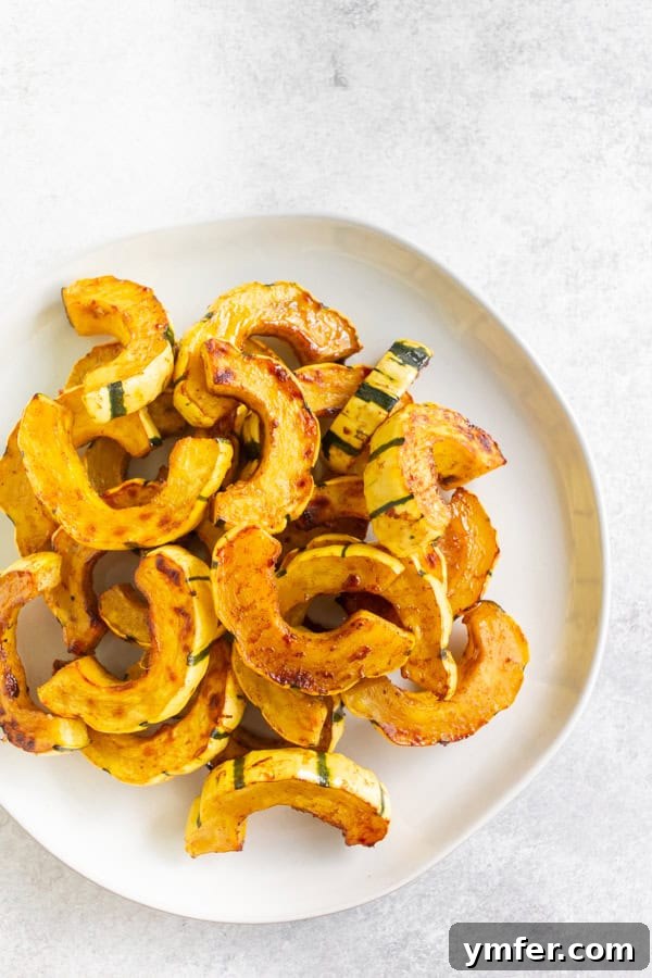Maple Cinnamon Delicata Jewels 4 Cinnamon Maple Roasted Delicata Squash on a white plate, ready to be served.