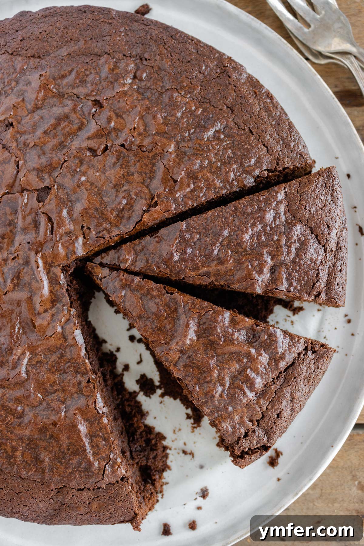 Decadent Chocolate Brownie Cake 3 Close-up of a perfectly baked vegan chocolate brownie cake with a rich, dark crackled crust