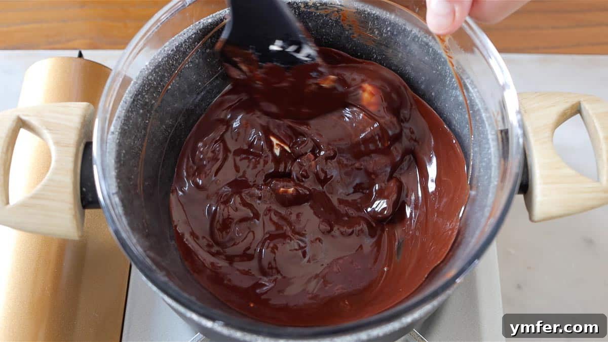 Decadent Chocolate Brownie Cake 8 Glossy melted chocolate and butter mixture, perfectly smooth and ready for the next step