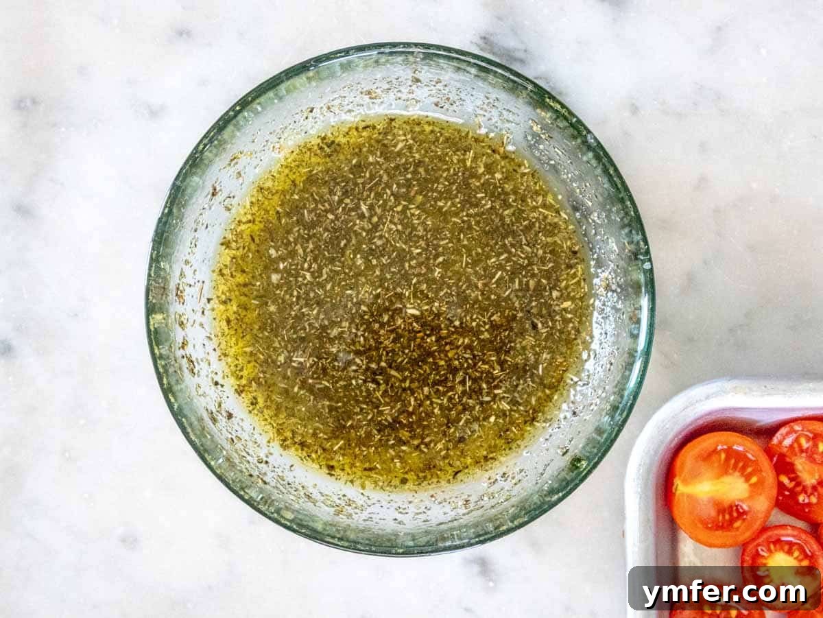 Slow-Roasted Tomato Jewels 6 cherry tomatoes and oregano marinade in a bowl