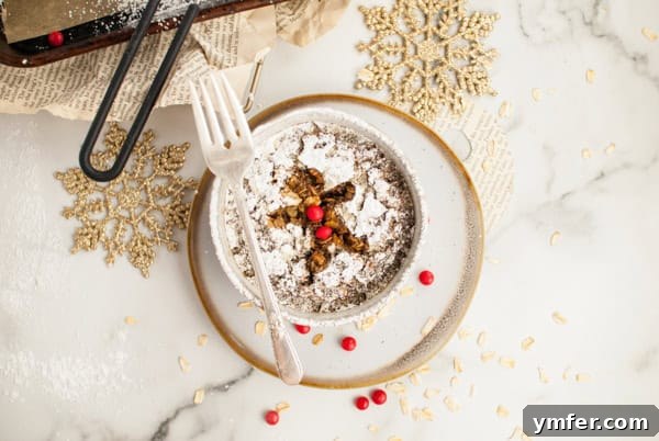 Cozy Gingerbread Oat Bake 11 A bowl of Baked Gingerbread Oatmeal on a plate, garnished and ready to serve.