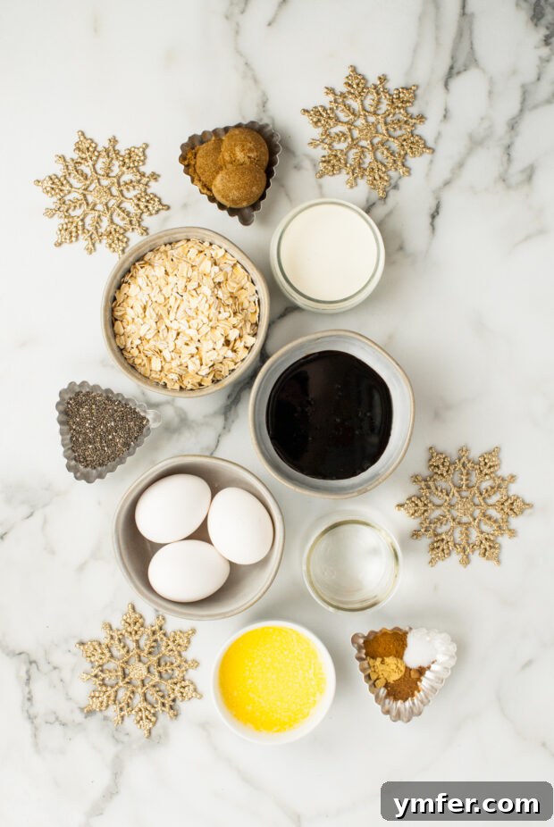 Cozy Gingerbread Oat Bake 3 A collection of ingredients for Baked Gingerbread Oatmeal laid out on a marble countertop.