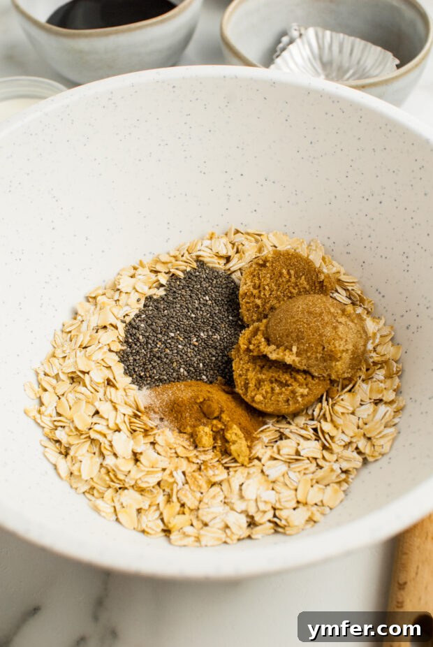 Cozy Gingerbread Oat Bake 4 Dry ingredients for baked oatmeal mixed in a bowl.