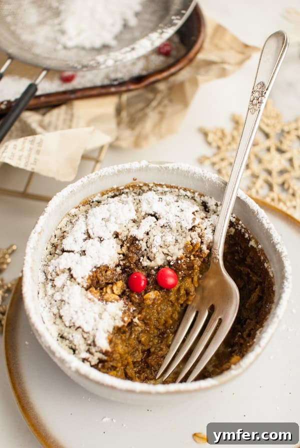 Cozy Gingerbread Oat Bake 10 Close-up of Baked Gingerbread Oatmeal in a bowl with a fork, ready to be eaten.