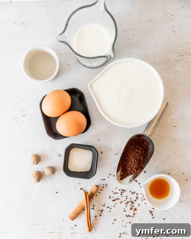 Velvet Eggnog Coffee Indulgence 3 Fresh ingredients for Eggnog Whipped Coffee laid out on a table, including eggnog, instant coffee, and spices.