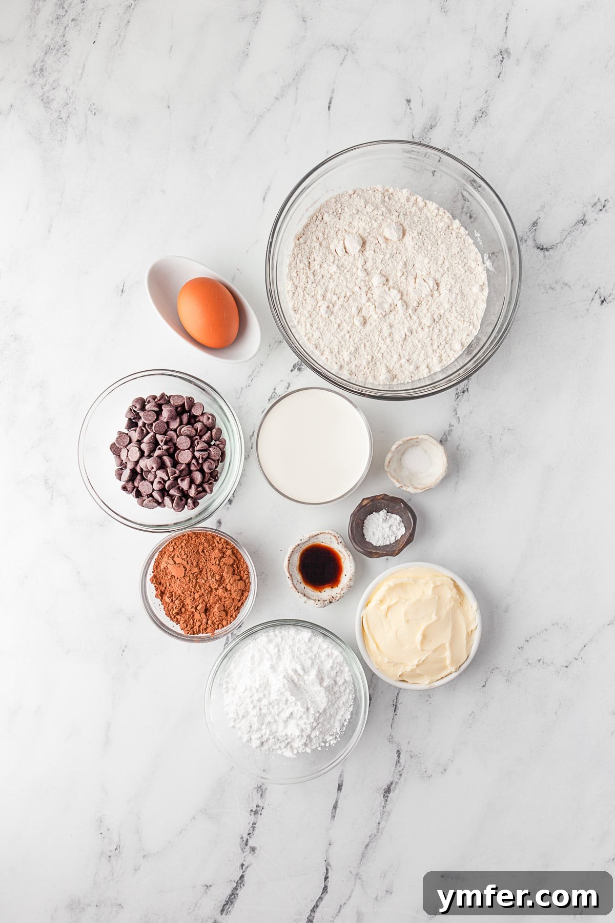 Rich Double Chocolate Thumbprint Gems 3 A flat lay photograph showcasing all the fresh, high-quality ingredients meticulously laid out on a clean kitchen counter, ready to be transformed into Double Chocolate Thumbprint Cookies.