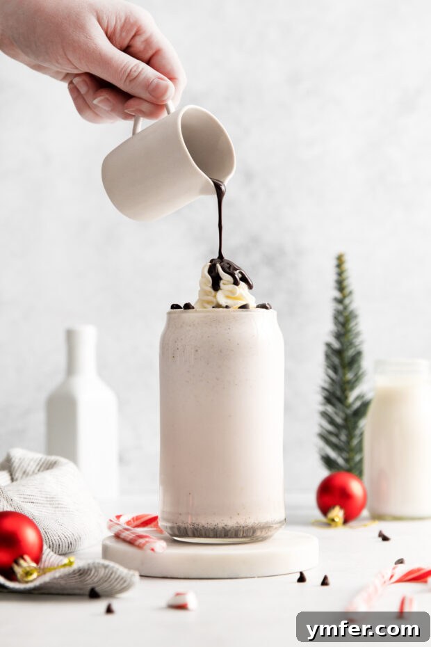 Candy Cane Crunch Milkshake 6 Pouring chocolate on a Peppermint Bark Milkshake.