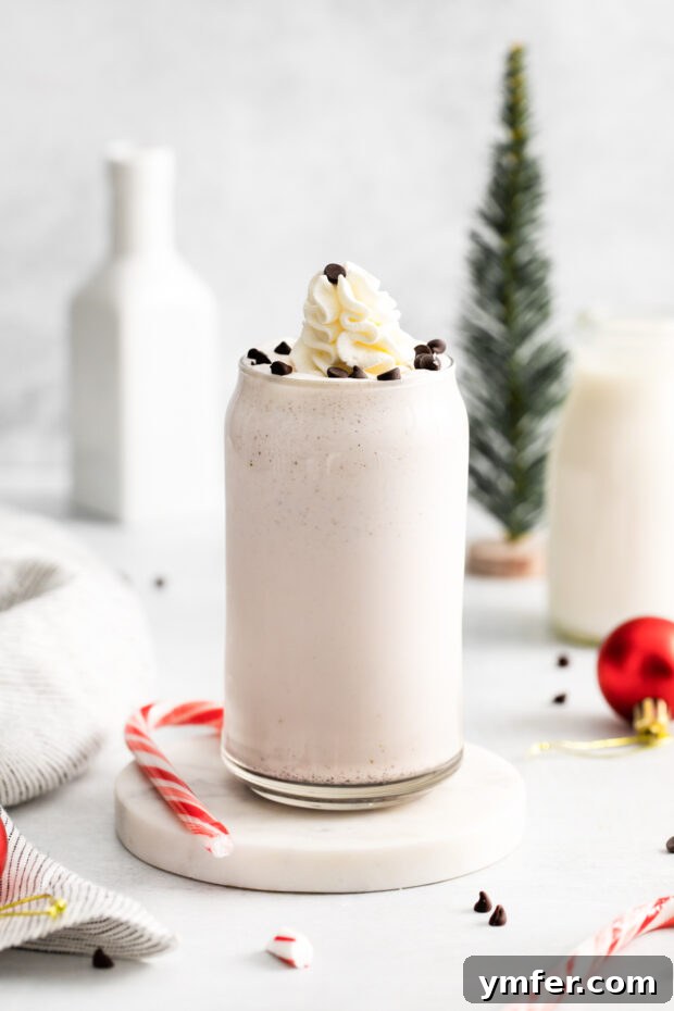 Candy Cane Crunch Milkshake 8 Peppermint Bark Milkshake in a glass.