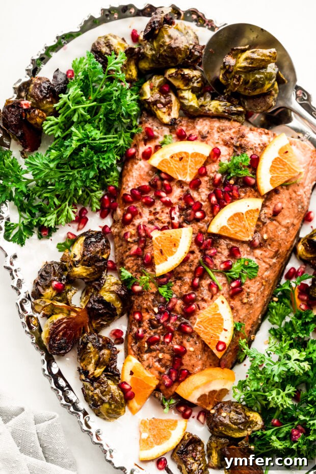 Simple Sheet Pan Marinated Salmon Dinner 2 Flavorful Marinated Sheet Pan Salmon with roasted Brussels sprouts, elegantly presented on a serving platter, ready to enjoy.