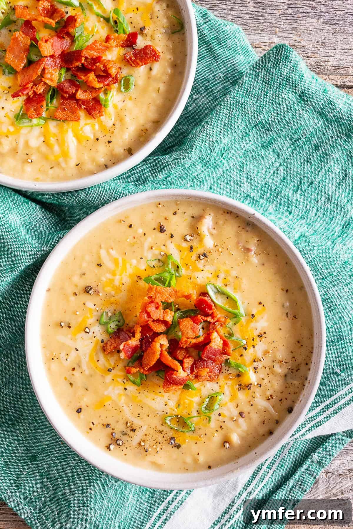 Hearty Loaded Potato Chowder 4 Creamy loaded baked potato soup, richly topped with a mound of shredded cheddar cheese, ready to melt.