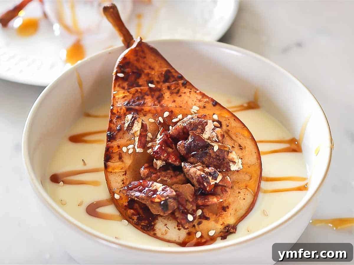 Baked pear served on a bed of yogurt, topped with a drizzle of syrup.
