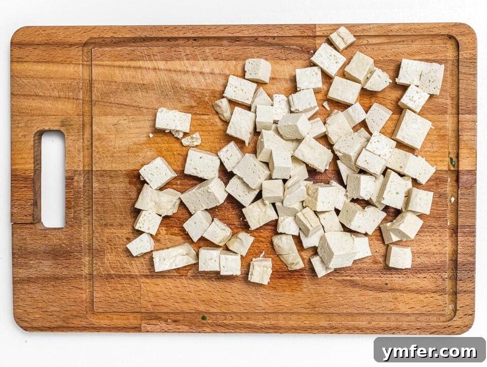 The Forager's Tofu Cacciatore 7 Firm tofu pressed and cut into uniform cubes, ready for seasoning and baking.