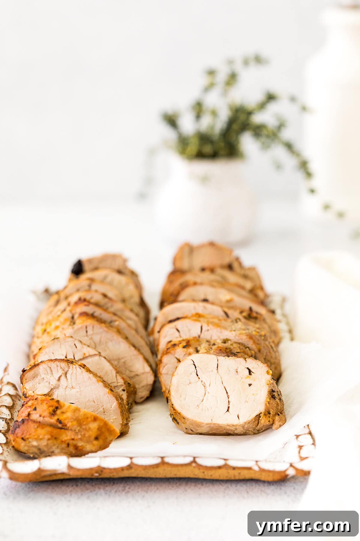 Perfect Air Fryer Pork Tenderloin 9 Air Fryer Pork Tenderloin sliced and arranged beautifully on a platter.