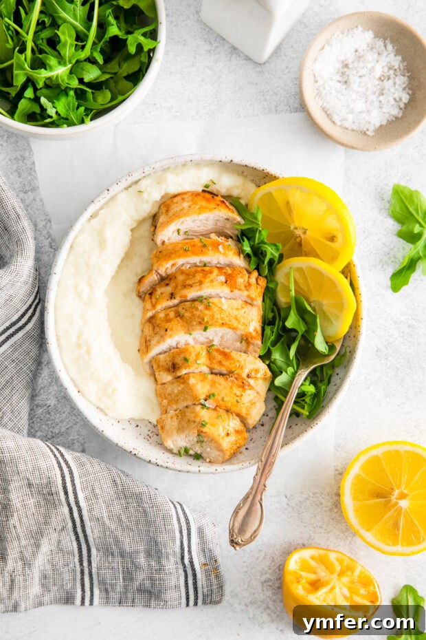 Crispy Zesty Air Fryer Lemon Chicken 2 Air Fryer Lemon Chicken served with salad and mashed potatoes.