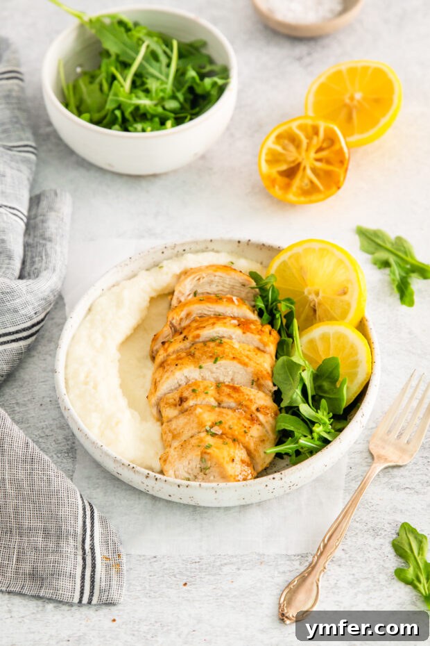 Crispy Zesty Air Fryer Lemon Chicken 9 Air Fryer Lemon Chicken on a plate.