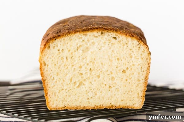 Classic English Muffin Toast Loaf 5 A plate with English Muffin Toasting Bread slices and fruit, suitable for sandwiches.