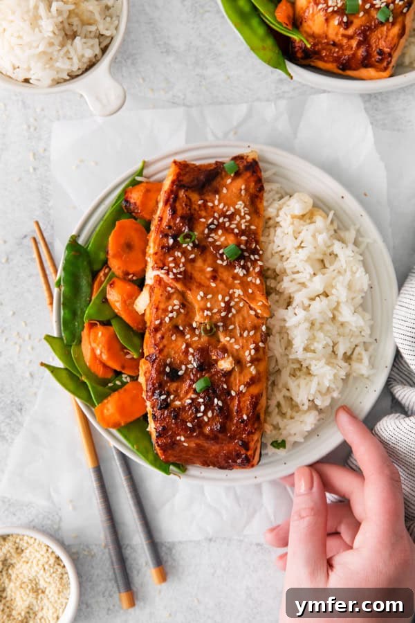 Air Fried Miso-Glazed Salmon 7 Air Fryer Miso Salmon served with steamed rice and green vegetables, ready to eat.
