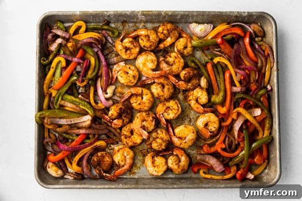 One-Pan Shrimp Fajitas 4 Shrimp, red and green bell peppers, and sliced red onions cooked together on a sheet pan, seasoned with fajita spices.